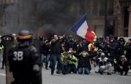 'Yellow vest' protests stunt French growth, Macron under pressure